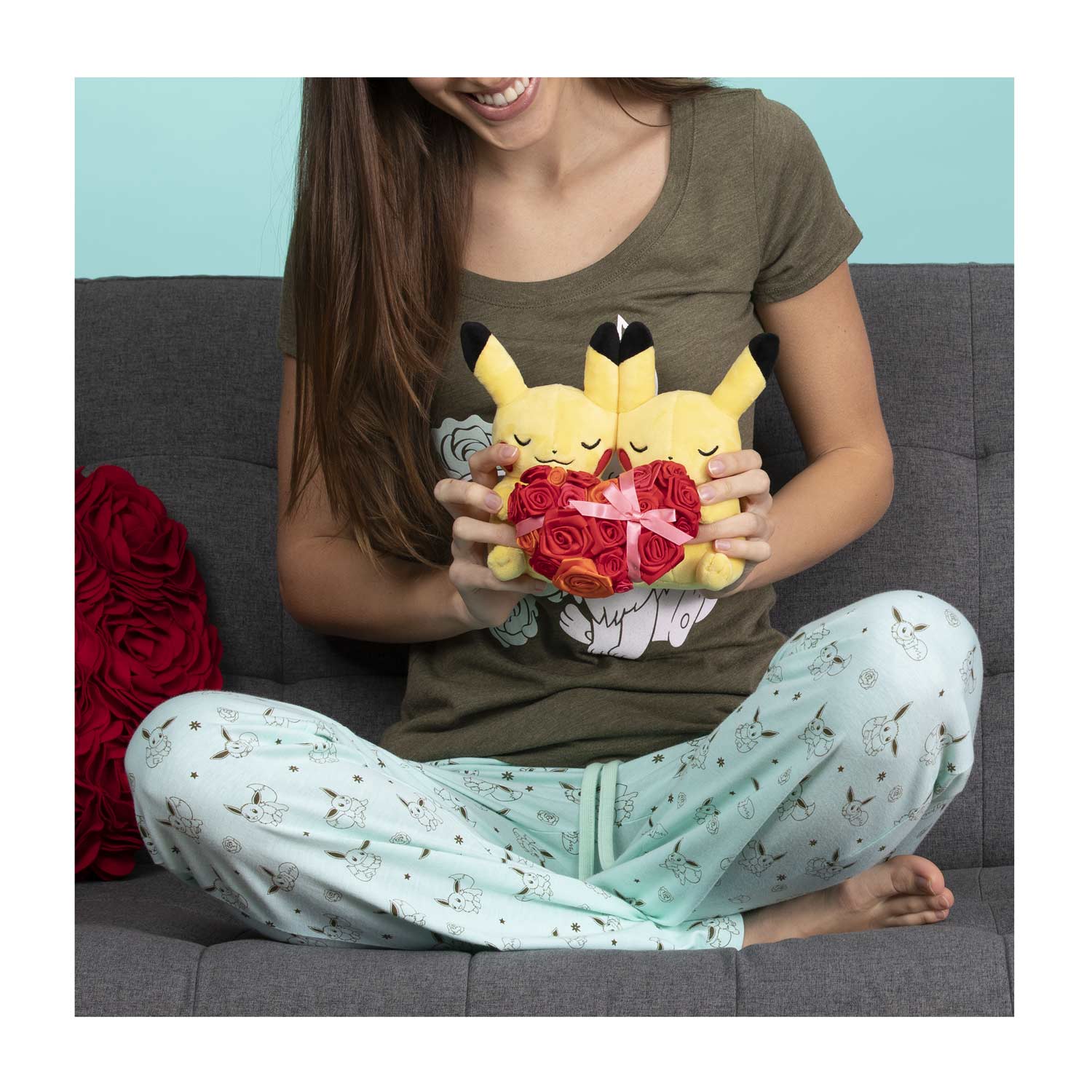 pikachu holding a heart plush